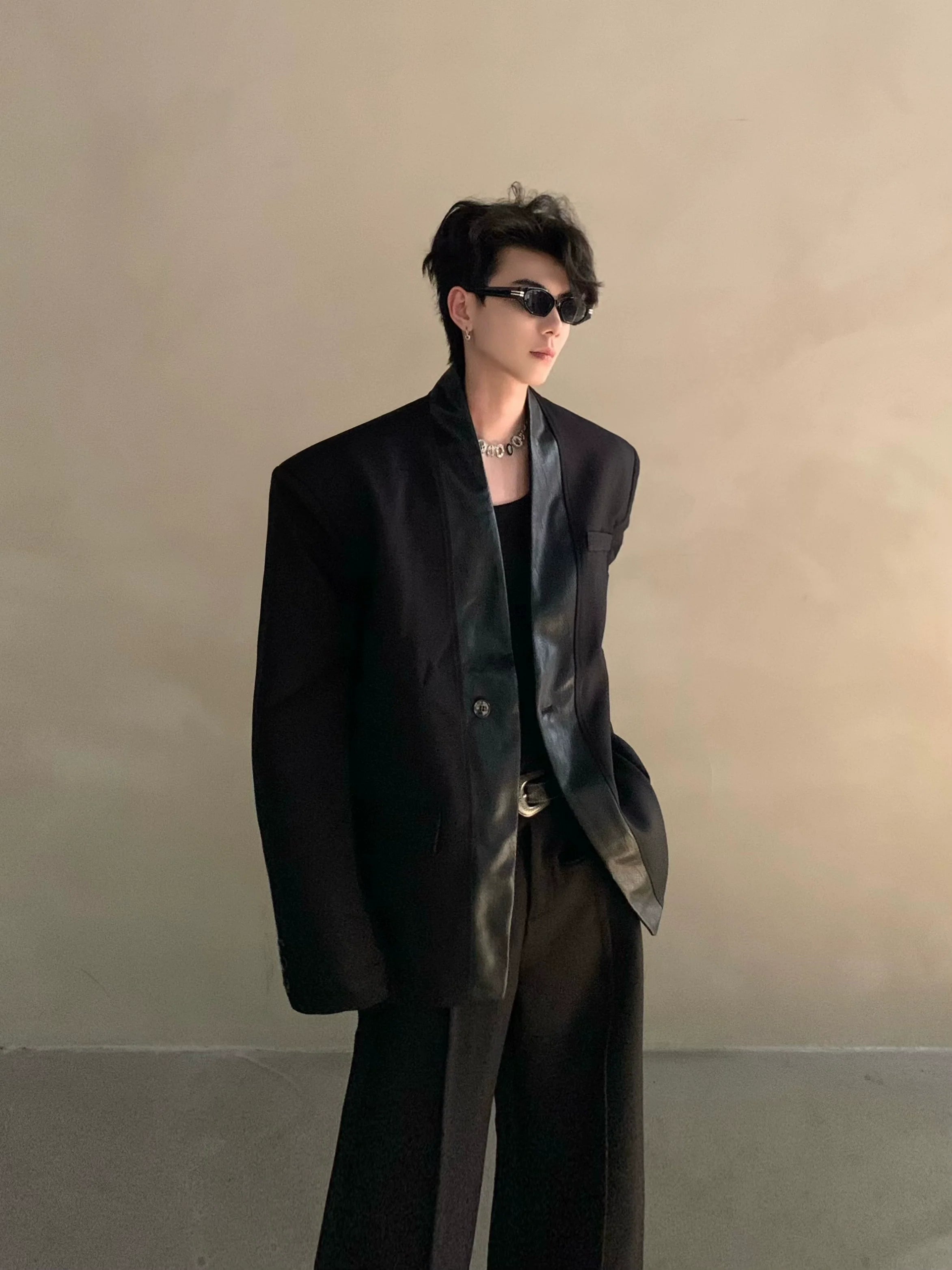 Autumn and winter black collarless suit splicing leather jacket profile shoulder pads light luxury ruffian handsome high-end jacket