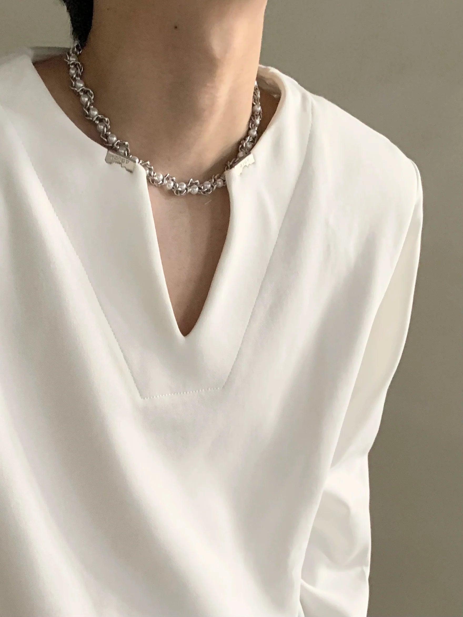 Autumn high-end V-neck metal decorative shoulder pads long-sleeved T-shirt men's ruffian handsome loose top