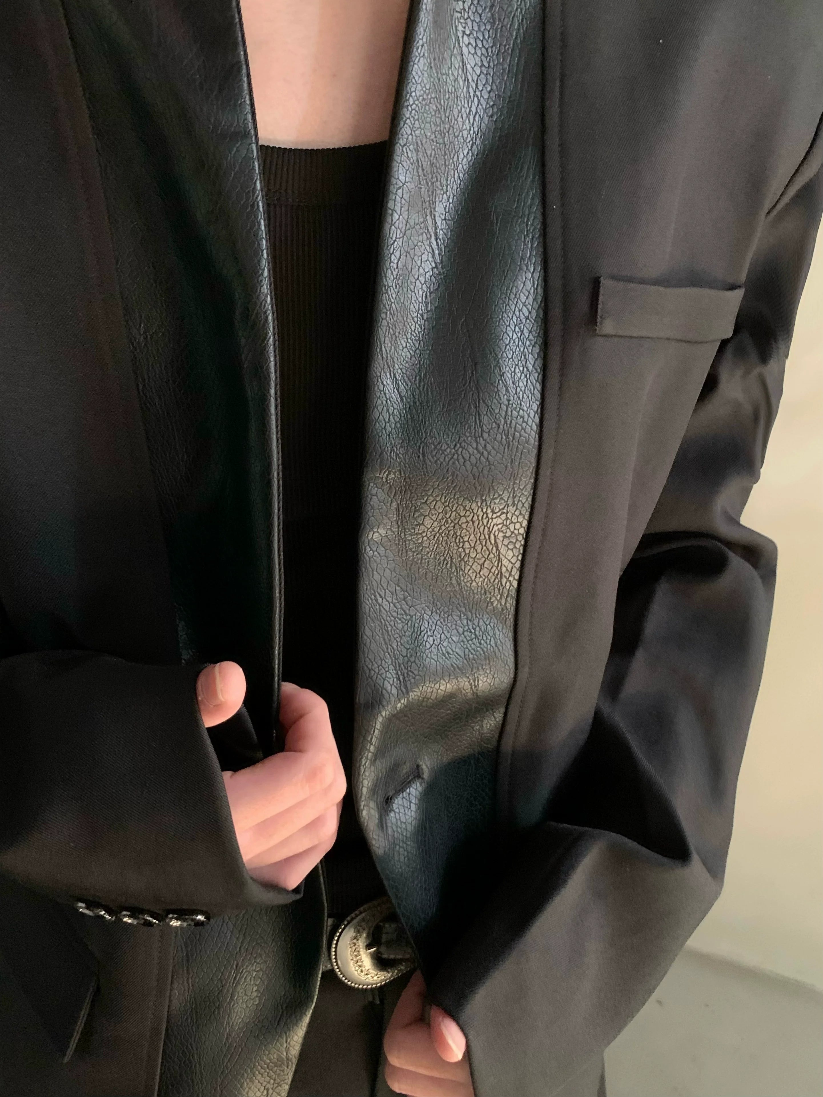 Autumn and winter black collarless suit splicing leather jacket profile shoulder pads light luxury ruffian handsome high-end jacket